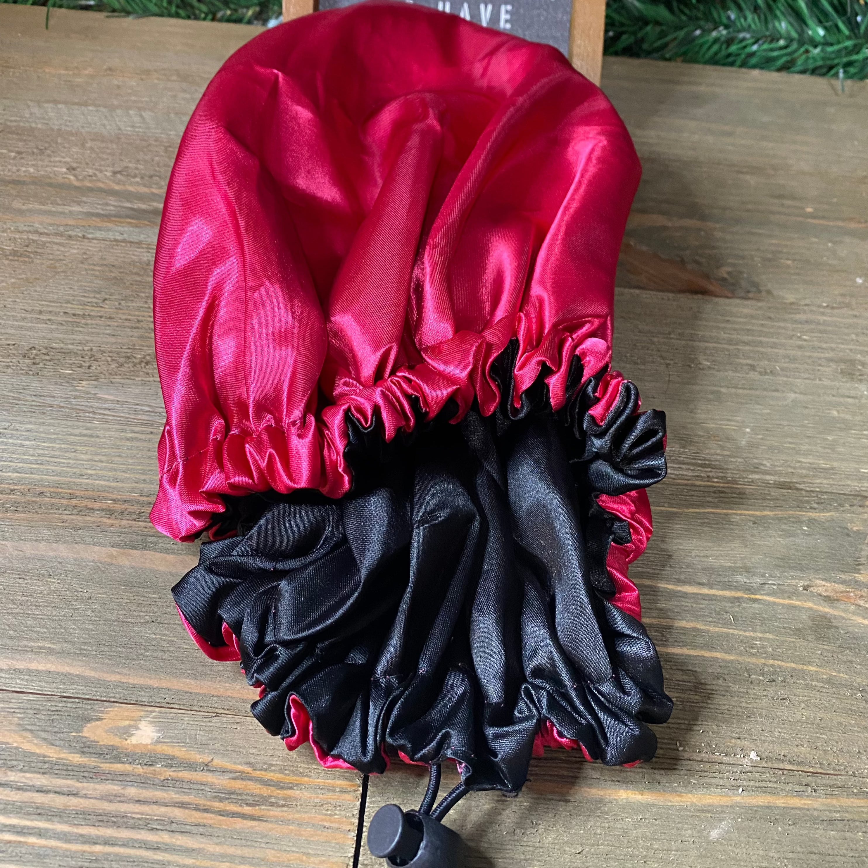 Red Silk hair bonnet that locks in moisture and prevents dryness