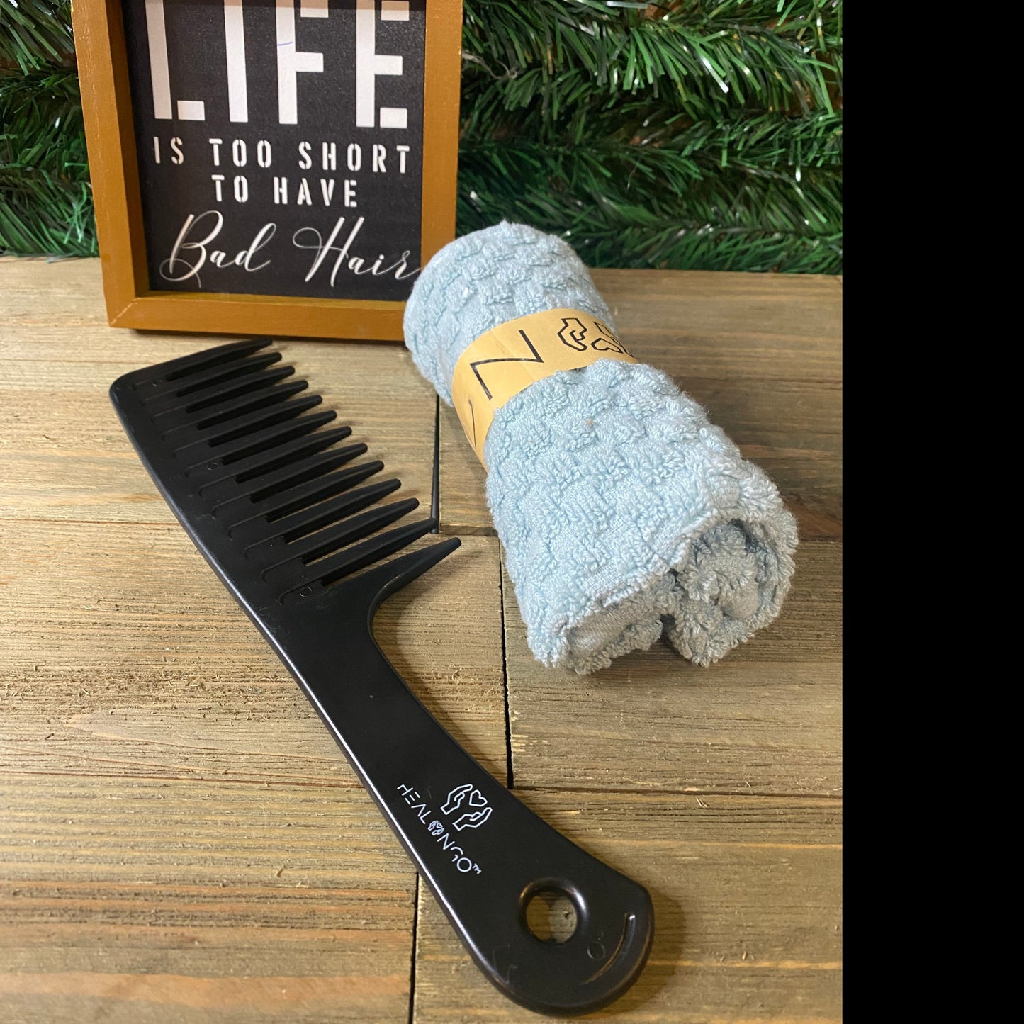 Black wide-tooth comb for detangling and natural hair care