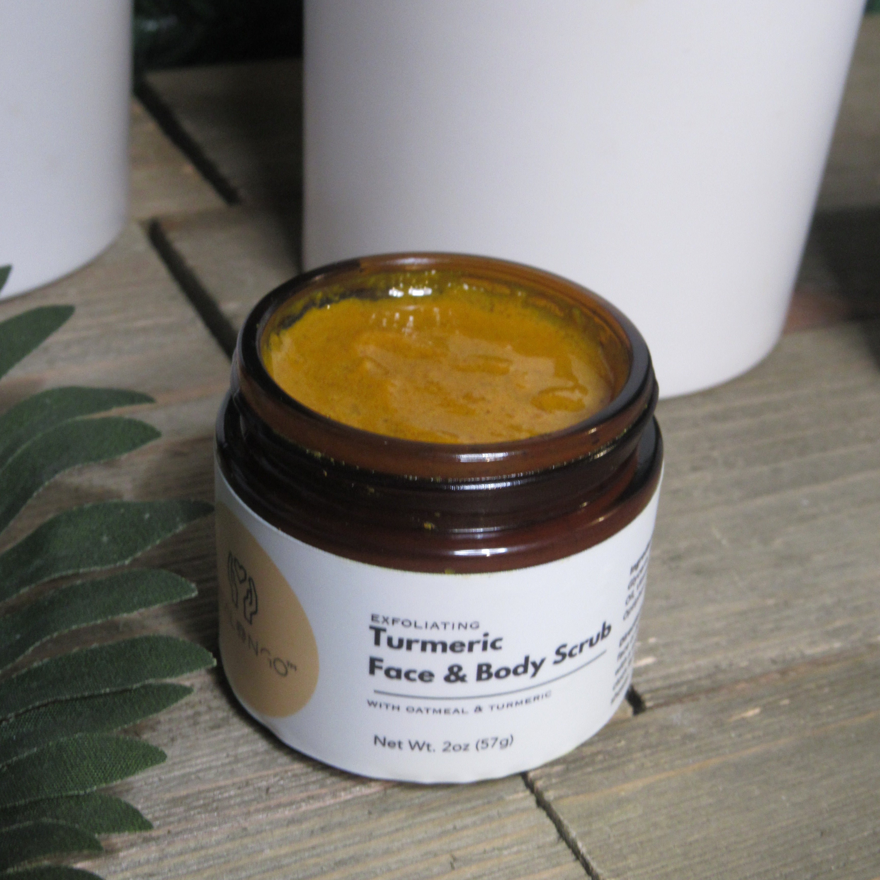 Natural turmeric skincare set including cleanser, exfoliating scrub, and hydrating turmeric cream.