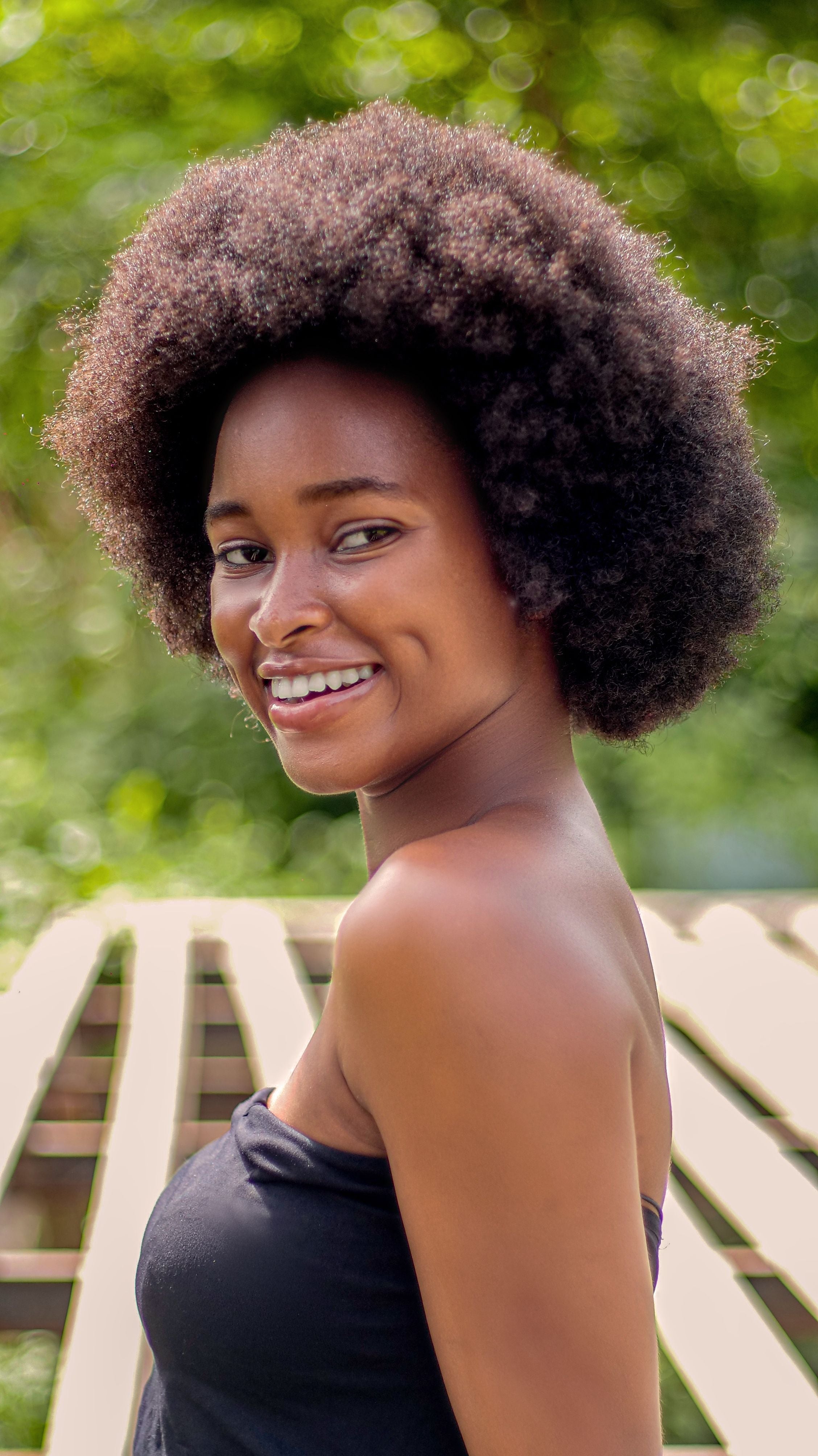 Step-by-step guide to transitioning from relaxed hair to natural hair safely with moisture care, scalp treatment, and protective styling