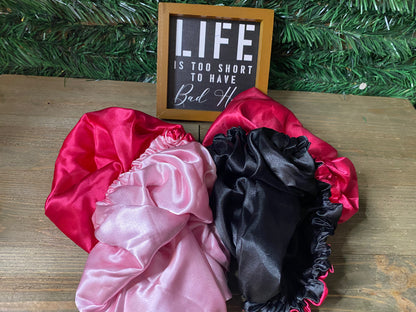  Red satin hair bonnet used during makeup and skincare routine