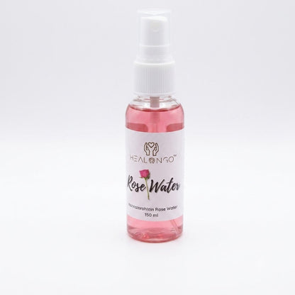 Woman using Rose Water Nourish Skin &amp; Refresh Hair mist, hydrating facial toner spray for glowing skin and lightweight hair refresher for curls, braids, and natural textured hair, soothing daily moisture boost for skin and scalp.