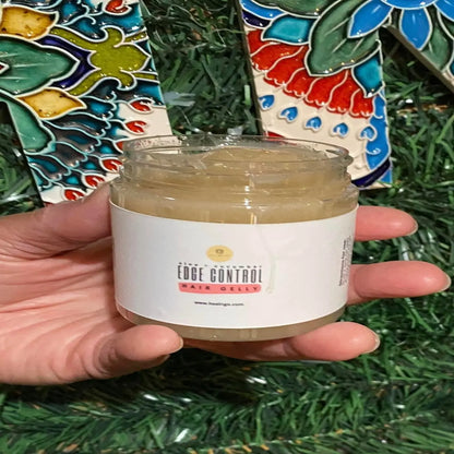 The Aloe + Cucumber Edge Control Hair Gelly will define and keep the curls bouncy and not stiff as other gels do. Made with all natural  products.