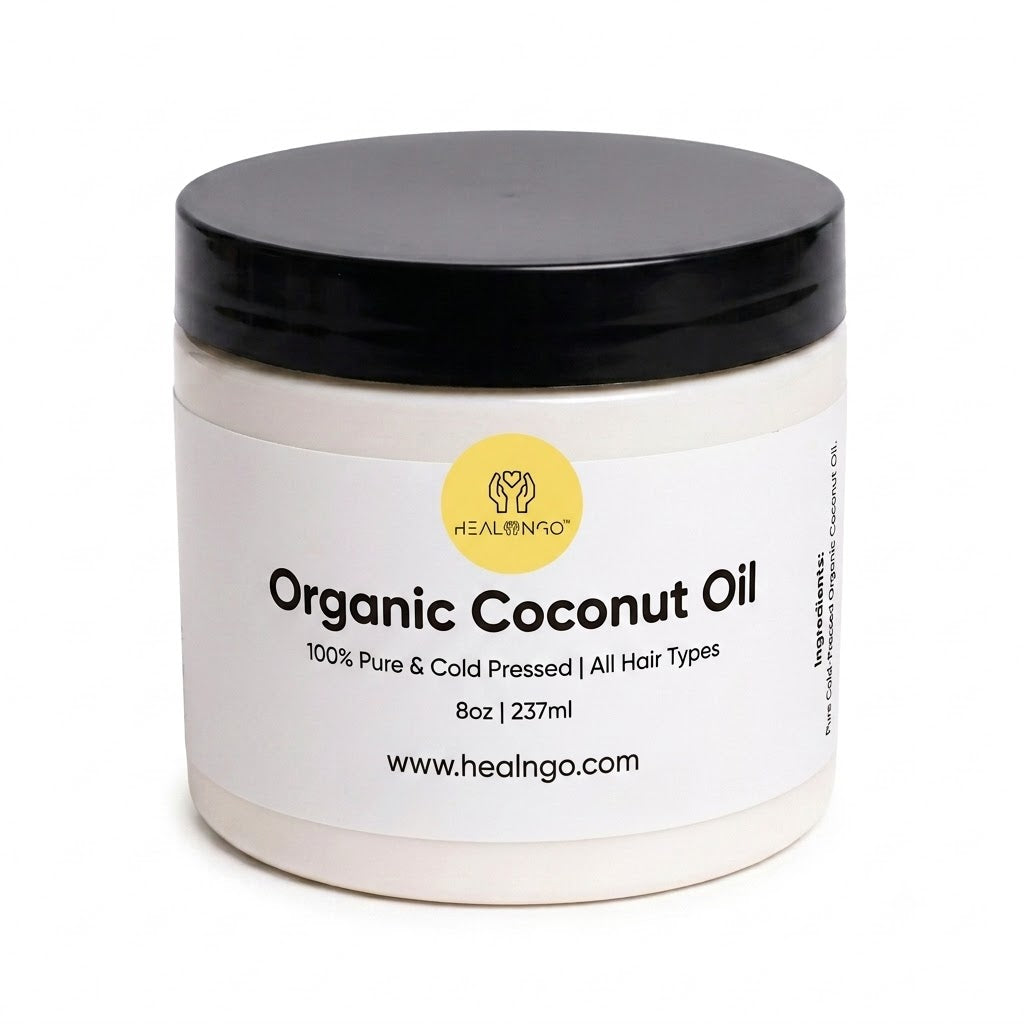 Jar of organic coconut oil with a black lid on a white background